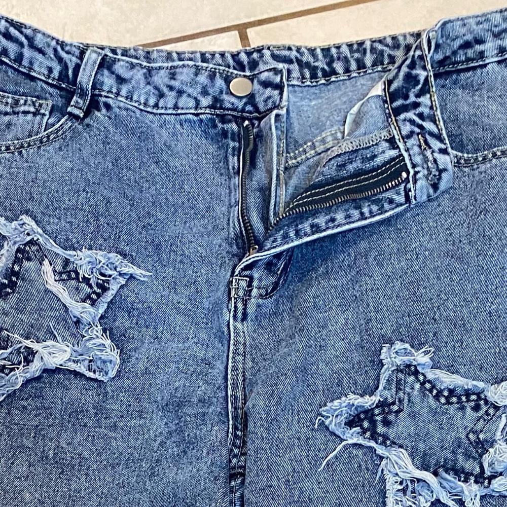 Light colored star patched Jeans